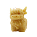 Handgefertigte Bienenwachskerze in Form eines Highland Cows