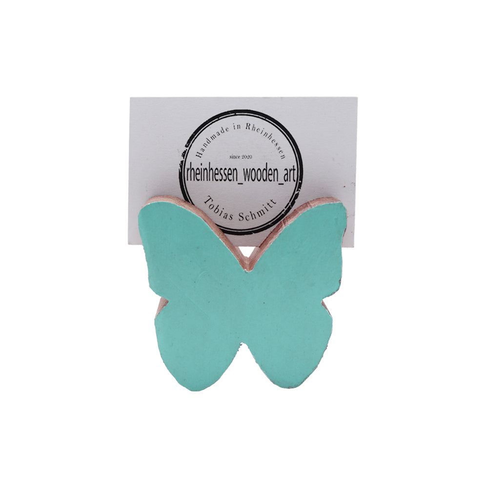 Kleiner bunter Schmetterling als Fotohalter aus Holz alter Weinfässer